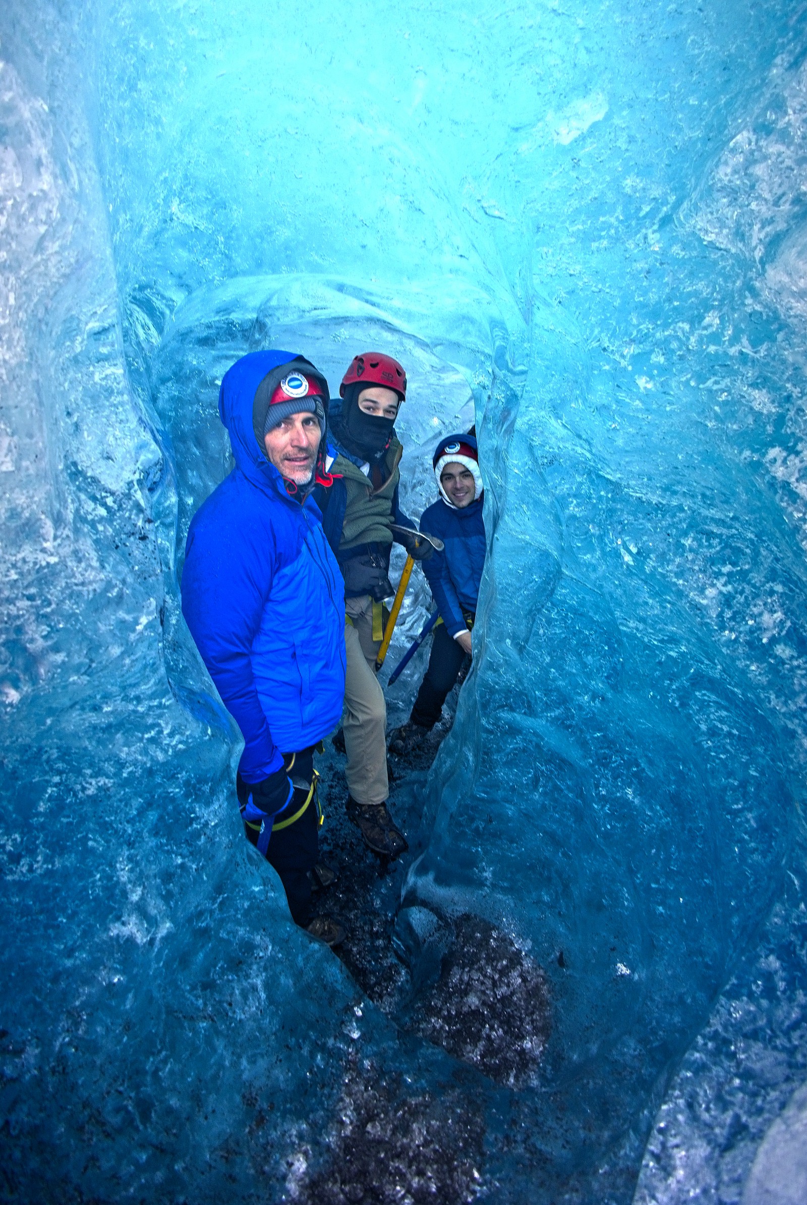Blue Iceland guests in blue tunnel upon Vatnajökull Glacier - Blue Iceland - Ice Caving and Hiking